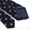 Cravate bleue à motif jacquard rouge et doré