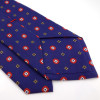Cravate bleue en soie à petits imprimés rouges et jaunes