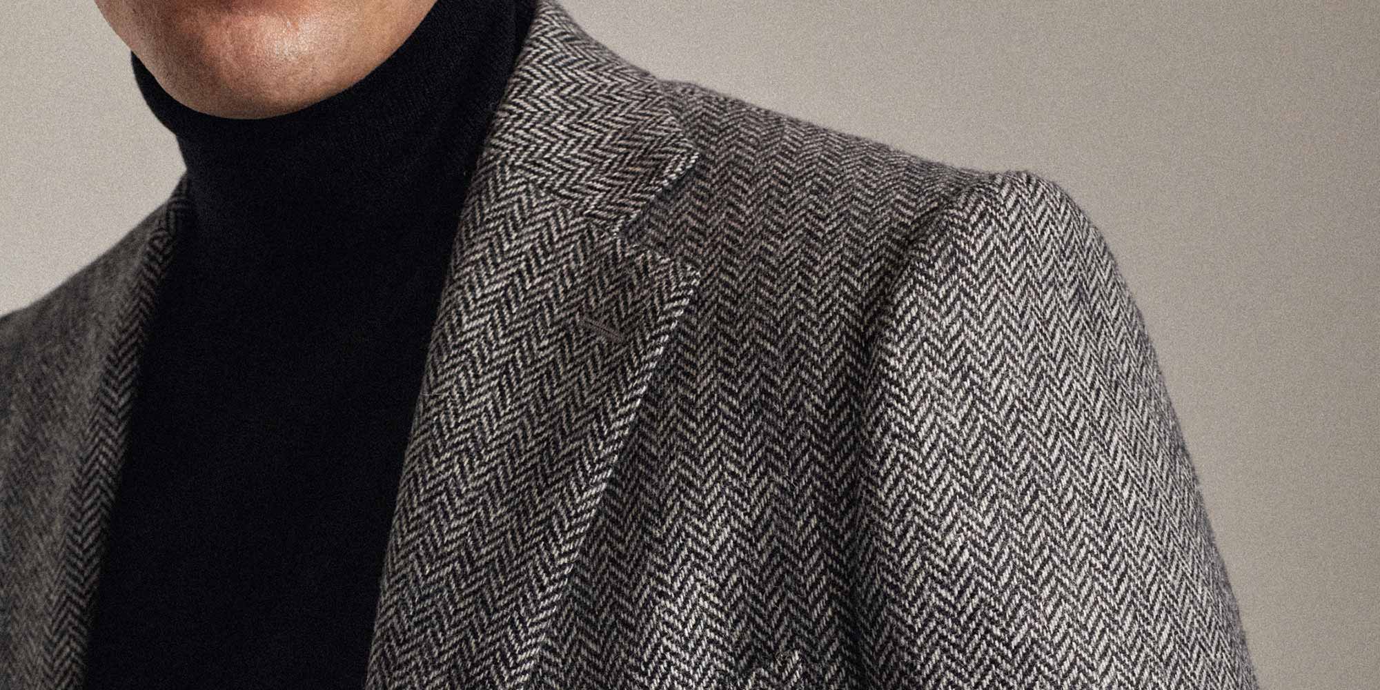 La veste en tweed à chevrons gris noir